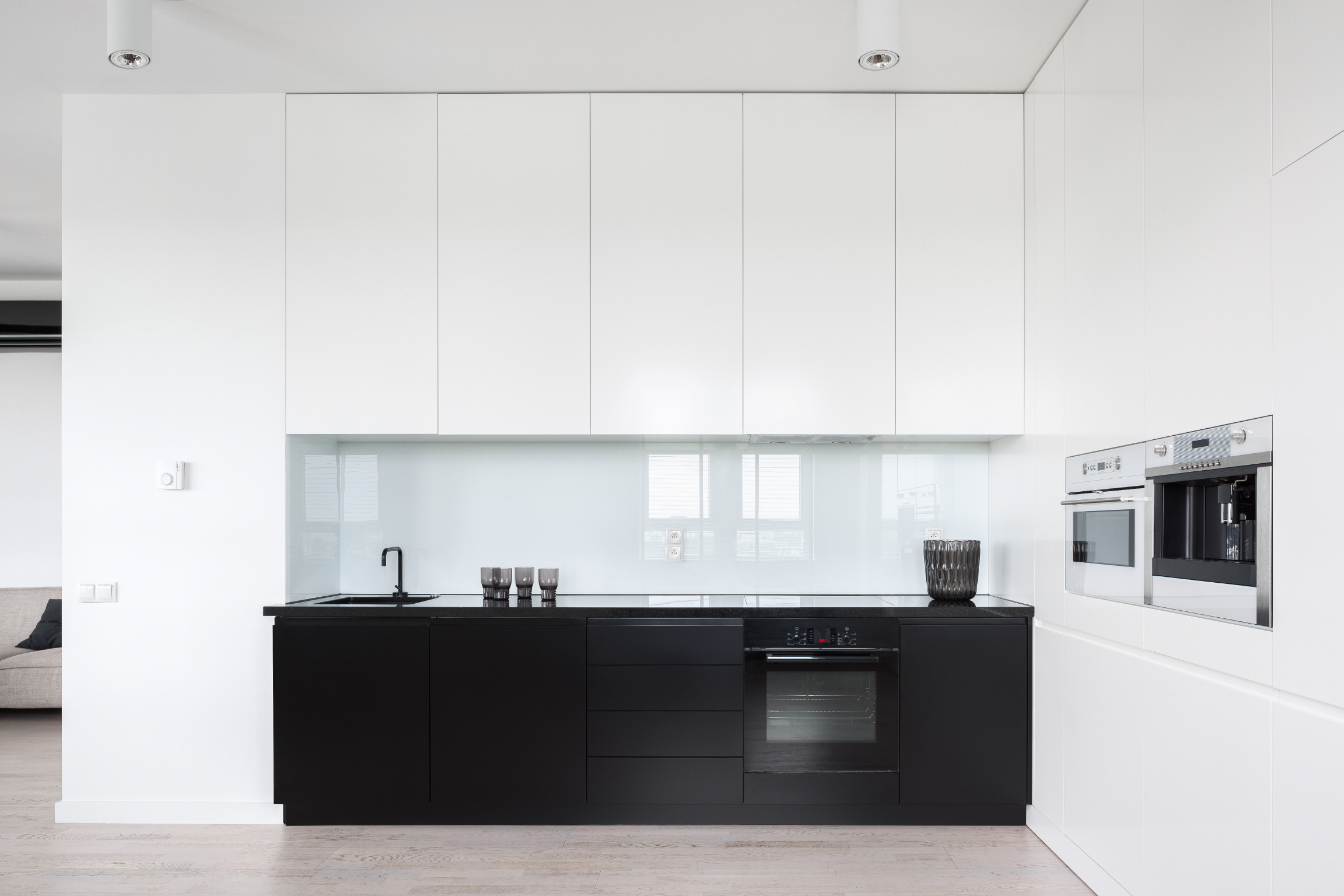 Use a glass backsplash to reflect natural light and make your kitchen appear more spacious.