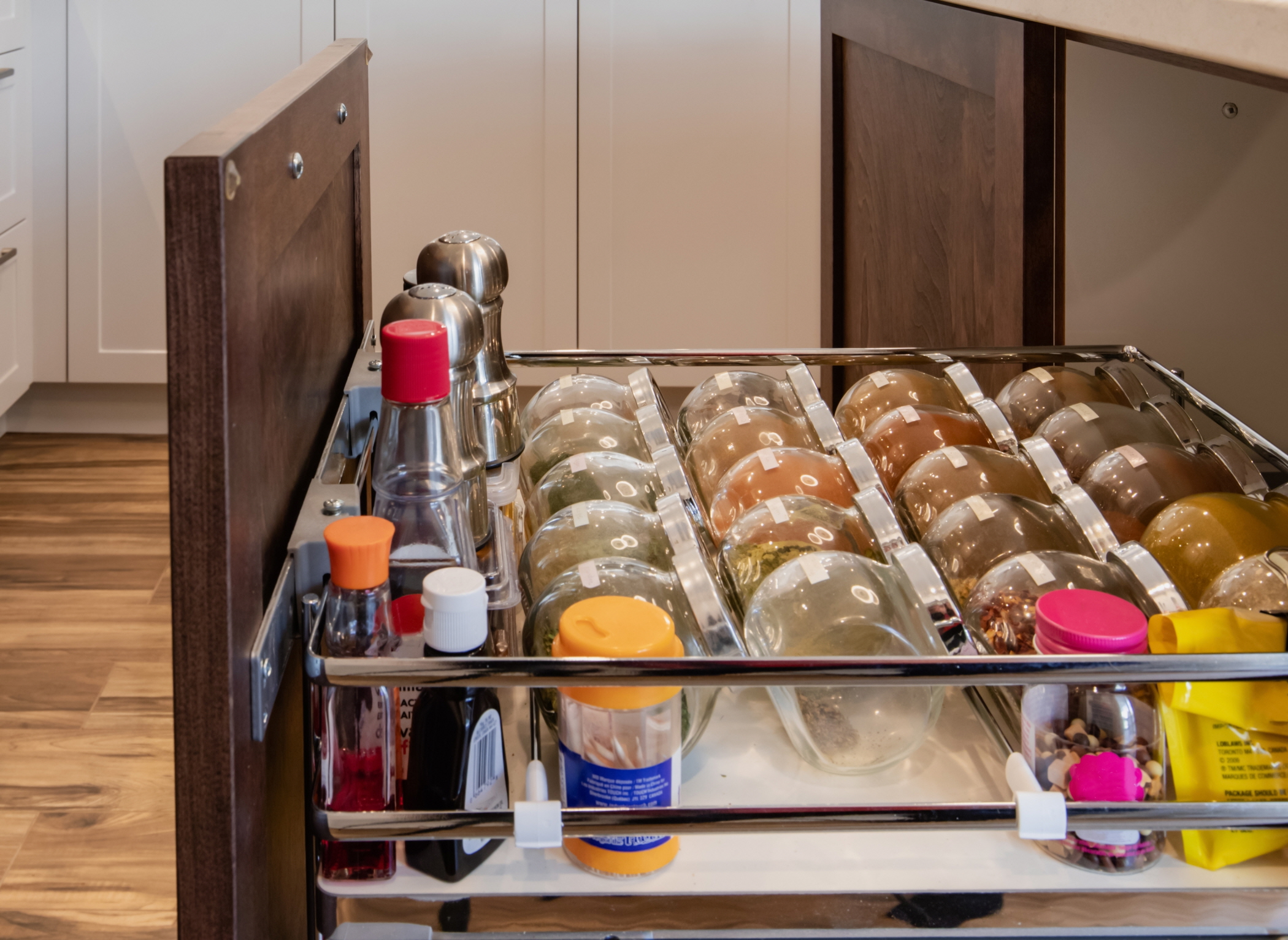 To enhance the efficiency of your kitchen space, set up a dedicated drawer for organizing spices.