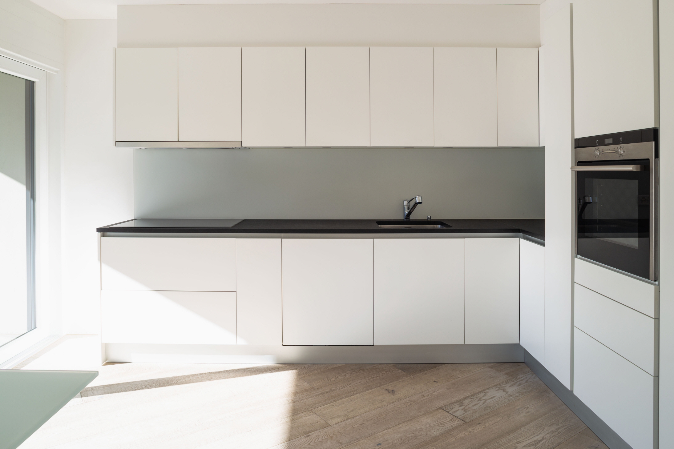 Modern cabinet door styles emphasize clean lines for a sleek and sophisticated design.