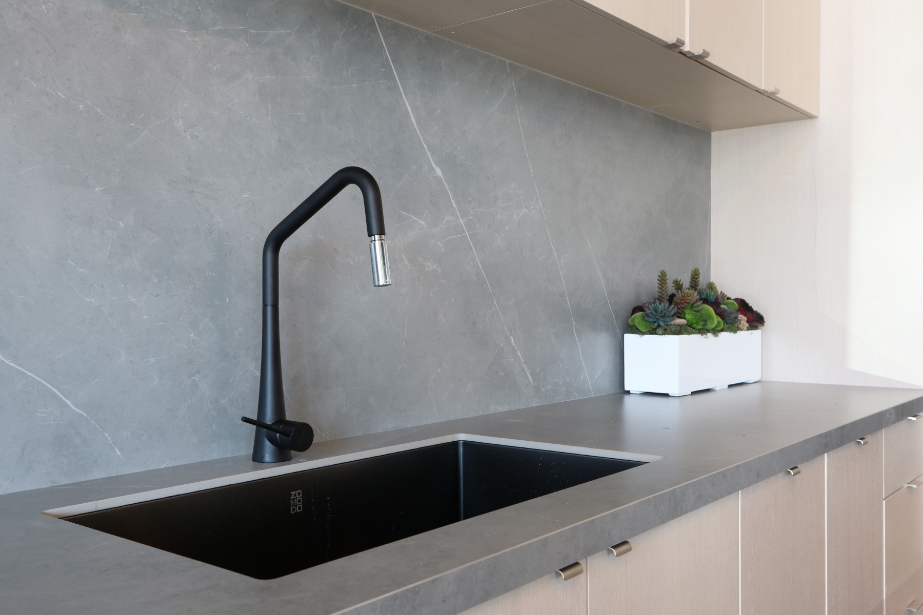 A plaster backsplash is a durable and eco-friendly alternative to a traditional painted backsplash.