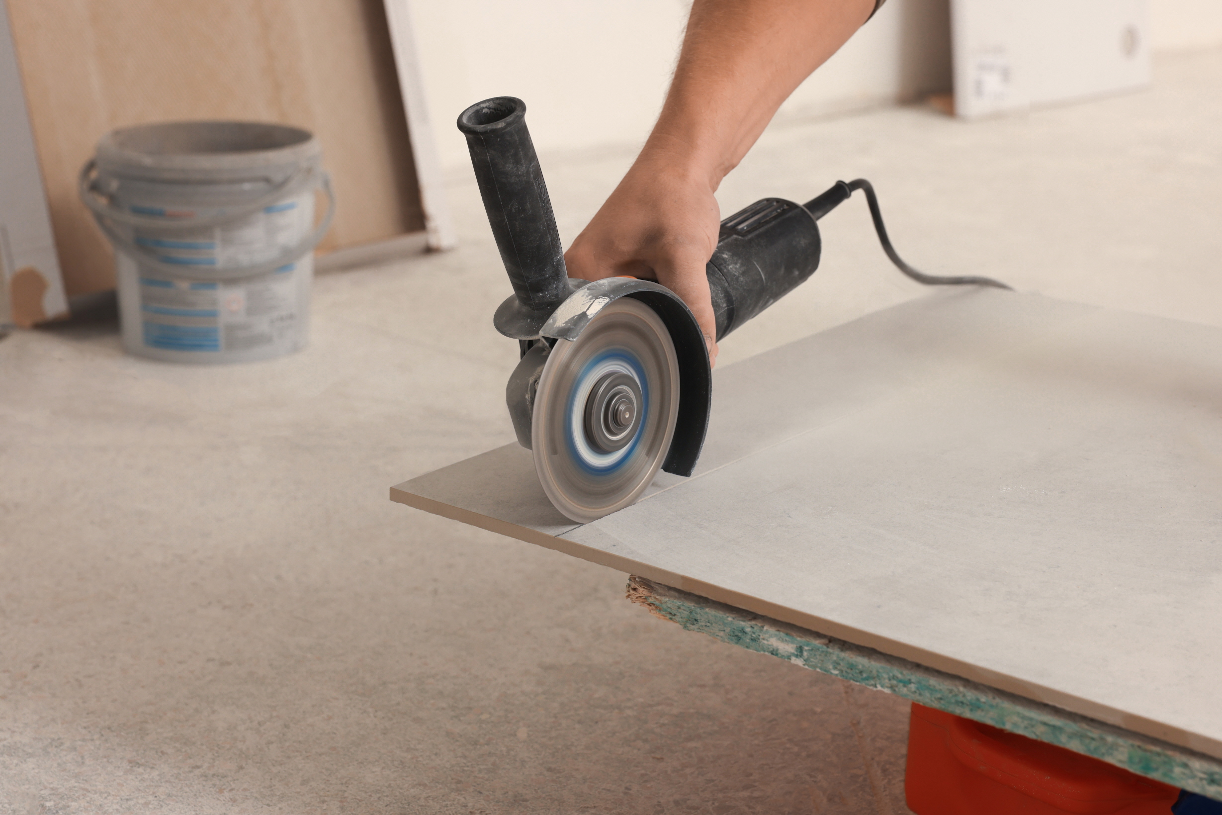 Some tiles may need to be cut to fit the shape and design of the backsplash.